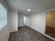 Bright bedroom featuring modern flooring and a window at 8018 Mulberry St, Tampa, FL 33604