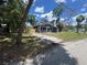 Charming single-story home with a well-maintained lawn and mature trees at 8018 Mulberry St, Tampa, FL 33604