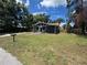 Charming single-story home with a well-maintained lawn and mature trees at 8018 Mulberry St, Tampa, FL 33604