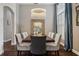 Elegant dining room featuring modern chandelier, large mirror, and seating for eight at 803 Brooker Village Cir, Lutz, FL 33548