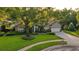 Charming home with a lush front yard and a circular driveway at 803 Brooker Village Cir, Lutz, FL 33548