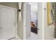 Hallway with a view of a bedroom, featuring neutral walls and decor at 803 Brooker Village Cir, Lutz, FL 33548
