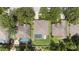Overhead view showcases the property's layout with pool, fenced yard, and neighborhood at 8836 Alafia Cove Dr, Riverview, FL 33569