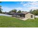 Beautiful backyard with manicured lawn and screen enclosed pool area for outdoor entertainment at 8836 Alafia Cove Dr, Riverview, FL 33569