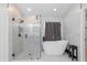 Bathroom featuring a walk-in glass shower and soaking tub at 8836 Alafia Cove Dr, Riverview, FL 33569