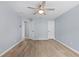 Bedroom with new wood-look flooring and ceiling fan at 8836 Alafia Cove Dr, Riverview, FL 33569