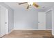 Spacious bedroom with ceiling fan, wood-look floors, and ensuite access at 8836 Alafia Cove Dr, Riverview, FL 33569