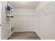 Walk-in closet with shelving and TV at 8836 Alafia Cove Dr, Riverview, FL 33569