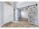 Foyer with decorative tile flooring, a white front door and a barn door that leads to an adjacent room at 8836 Alafia Cove Dr, Riverview, FL 33569