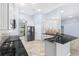 Updated kitchen featuring granite countertops, stainless steel appliances, and white cabinetry at 8836 Alafia Cove Dr, Riverview, FL 33569