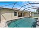 Screened-in pool with pristine water, patio, and outdoor lounge area at 8836 Alafia Cove Dr, Riverview, FL 33569