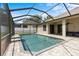 Screened-in pool with brick paver deck and a covered patio at 8836 Alafia Cove Dr, Riverview, FL 33569
