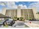 Beautiful view of the well-maintained condo building with parking at 900 Cove Cay Dr # 1B, Clearwater, FL 33760