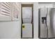 Efficient laundry closet featuring stackable washer and dryer, and shelving at 900 Cove Cay Dr # 1B, Clearwater, FL 33760