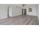 Bright living room featuring modern ceiling fan, neutral paint, and sleek light-gray flooring at 900 Cove Cay Dr # 1B, Clearwater, FL 33760