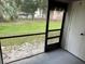 Screened balcony overlooking a green outdoor area at 101 Lake Ne Ave # 121, Largo, FL 33771