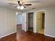Bedroom with attached bathroom, ceiling fan, and two closets at 101 Lake Ne Ave # 121, Largo, FL 33771