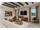 Cozy living room with stylish furnishings, modern lighting, and a comfortable seating area at 10305 Cross River Trl, Parrish, FL 34219