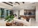 Bright living room with a view to kitchen and dining area, perfect for entertaining and relaxation at 10305 Cross River Trl, Parrish, FL 34219