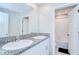 Bathroom featuring dual sinks with granite countertops and shower/tub combination at 10360 Blue Plume Ct, Riverview, FL 33578