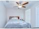 Comfortable bedroom features a ceiling fan and a window, creating a restful retreat at 10360 Blue Plume Ct, Riverview, FL 33578