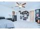 Spacious bedroom with ample natural light and a ceiling fan providing comfort at 10360 Blue Plume Ct, Riverview, FL 33578