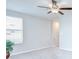 Neutral bonus room with a ceiling fan and natural light, creating a welcoming space at 10360 Blue Plume Ct, Riverview, FL 33578