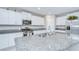 Kitchen featuring white cabinets, stainless steel appliances, granite counters, and a large island at 10360 Blue Plume Ct, Riverview, FL 33578