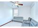 Versatile living room features a modern sectional sofa, offering ample seating at 10360 Blue Plume Ct, Riverview, FL 33578
