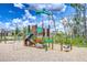 Colorful community playground with climbing structures, slides, and a swing set for children to enjoy at 10360 Blue Plume Ct, Riverview, FL 33578