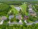 Beautiful aerial shot of a home located near a lush green golf course and a serene lake at 10532 Plantation Bay Dr, Tampa, FL 33647