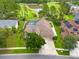 Stunning aerial view of a home featuring a private pool and well-manicured lawn in a golf community at 10532 Plantation Bay Dr, Tampa, FL 33647