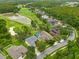 Attractive aerial view of homes with screened-in pools, adjacent to a scenic golf course and lush landscaping at 10532 Plantation Bay Dr, Tampa, FL 33647