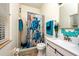 Bathroom featuring a sink, toilet, and a shower-tub combo with turtle-themed shower curtain at 10532 Plantation Bay Dr, Tampa, FL 33647