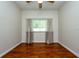 Bedroom featuring wood floor, ceiling fan, window with blinds and curtains at 10532 Plantation Bay Dr, Tampa, FL 33647
