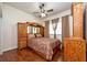 This bedroom features a ceiling fan, hardwood floors, and built in storage cabinets at 10532 Plantation Bay Dr, Tampa, FL 33647