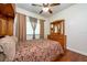 This bedroom features a ceiling fan, hardwood floors, and built in storage cabinets at 10532 Plantation Bay Dr, Tampa, FL 33647