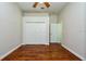 Bright bedroom with hardwood floors, neutral walls, closet and white door at 10532 Plantation Bay Dr, Tampa, FL 33647