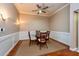 Elegant dining room with crown molding, chair railing, and a modern ceiling fan at 10532 Plantation Bay Dr, Tampa, FL 33647