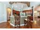 Kitchen with breakfast bar, granite countertops, stainless steel appliances, and hardwood floors at 10532 Plantation Bay Dr, Tampa, FL 33647