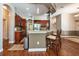 Open-concept kitchen with wood cabinets, stainless appliances, and easy access to other living spaces at 10532 Plantation Bay Dr, Tampa, FL 33647