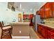 A stylish kitchen featuring granite countertops, stainless steel appliances, and cherry wood cabinetry at 10532 Plantation Bay Dr, Tampa, FL 33647