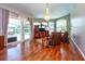 Bright living room with pool access, natural light, modern ceiling fan, and stylish hardwood flooring at 10532 Plantation Bay Dr, Tampa, FL 33647