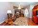 Bright living room with natural light, modern ceiling fan, stylish hardwood flooring, open to the kitchen at 10532 Plantation Bay Dr, Tampa, FL 33647