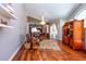 Bright living room with natural light, modern ceiling fan, stylish hardwood flooring, open to the kitchen at 10532 Plantation Bay Dr, Tampa, FL 33647
