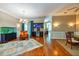 Living room boasts hardwood floors, a bar area, and a charming eclectic chair, perfect for entertaining at 10532 Plantation Bay Dr, Tampa, FL 33647