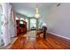 Bright living room with vaulted ceiling, natural light, modern ceiling fan, and stylish hardwood flooring at 10532 Plantation Bay Dr, Tampa, FL 33647