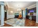 Living room with hardwood floors, wet bar with mini fridge, and decorative rug at 10532 Plantation Bay Dr, Tampa, FL 33647