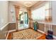 Inviting living space featuring decorative curtains, a surfboard, stylish rug, and modern lighting at 10532 Plantation Bay Dr, Tampa, FL 33647