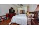 This main bedroom features a ceiling fan, hardwood floors, and two beds at 10532 Plantation Bay Dr, Tampa, FL 33647